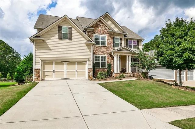 front view of a house with a yard