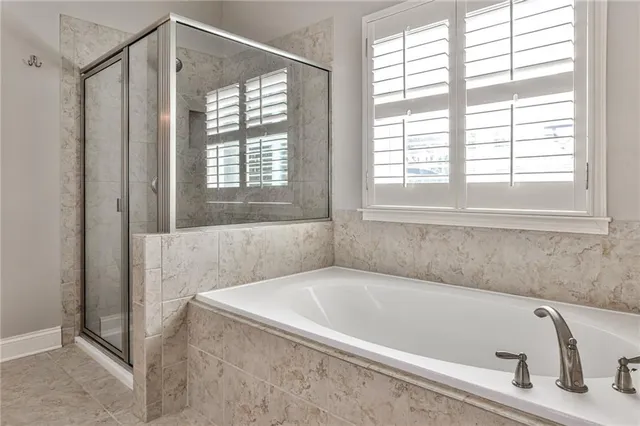 a white bath tub sitting next to a window