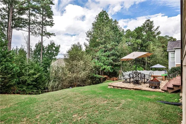 a view of a table and chairs under an umbrella