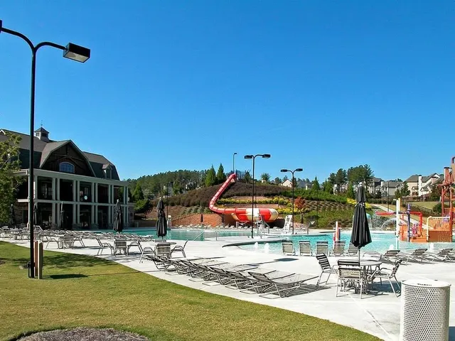 a view of a swimming pool with a chairs