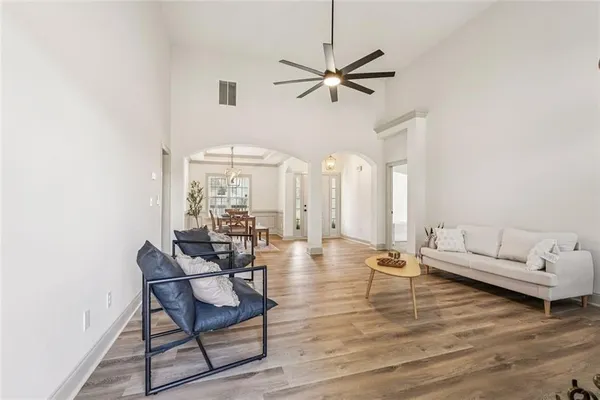a view of a dining room with furniture window and wooden floor