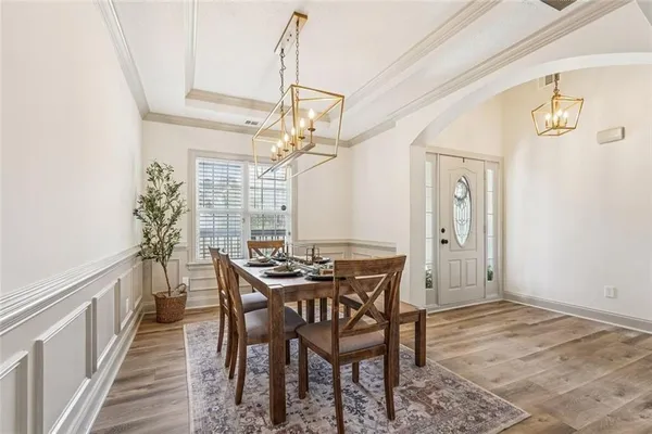 a kitchen with stainless steel appliances granite countertop a stove a sink dishwasher and a refrigerator