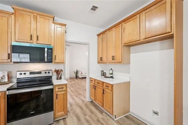 a bed room with a bed and a ceiling fan