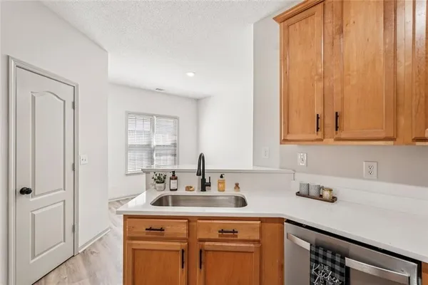 a bathroom with a double vanity sink and a window