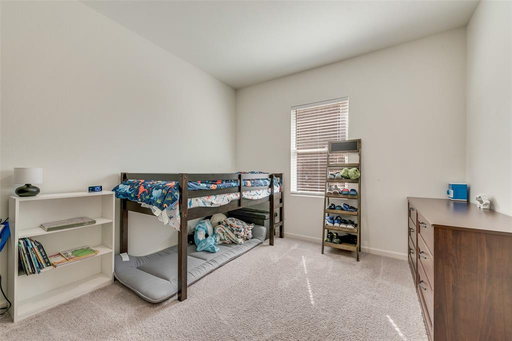 2544 Sanders Crk Road Glenn Heights, TX 75154 - Photo 11 of 20 a bedroom with furniture and a lamp