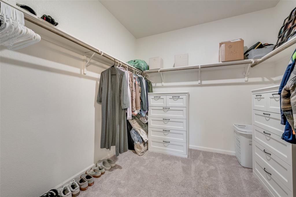 2544 Sanders Crk Road Glenn Heights, TX 75154 - Photo 15 of 20 a view of walk in closet with clothes