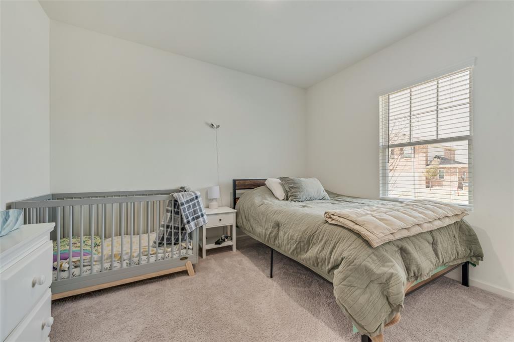 2544 Sanders Crk Road Glenn Heights, TX 75154 - Photo 10 of 20 a bedroom with a bed and a window