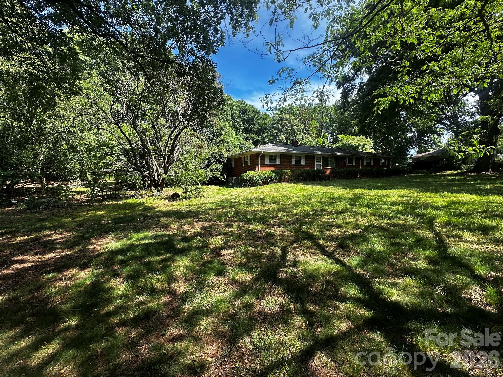 15023 Thompson Road Mint Hill, NC 28227 - Photo 2 of 3 a backyard of a house with lots of green space