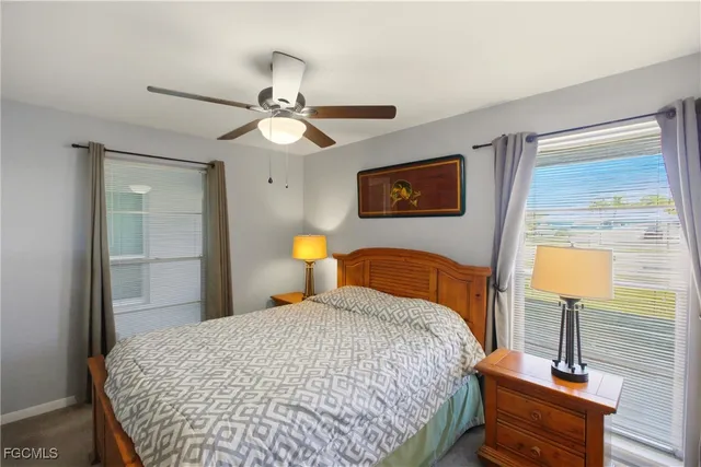 a bedroom with a bed and a table