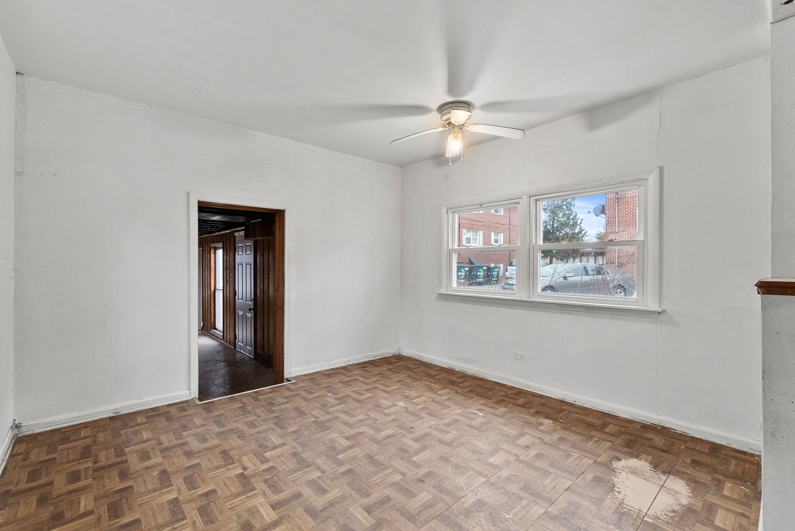 7911 45th Street Lyons, IL 60534 - Photo 12 of 22 a view of an empty room with a window