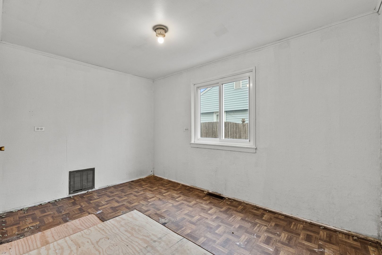 7911 45th Street Lyons, IL 60534 - Photo 13 of 22 a view of a bedroom with a bed and a window