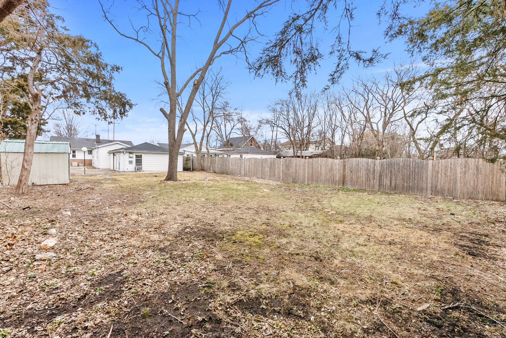 7911 45th Street Lyons, IL 60534 - Photo 20 of 22 a view of a backyard with large trees