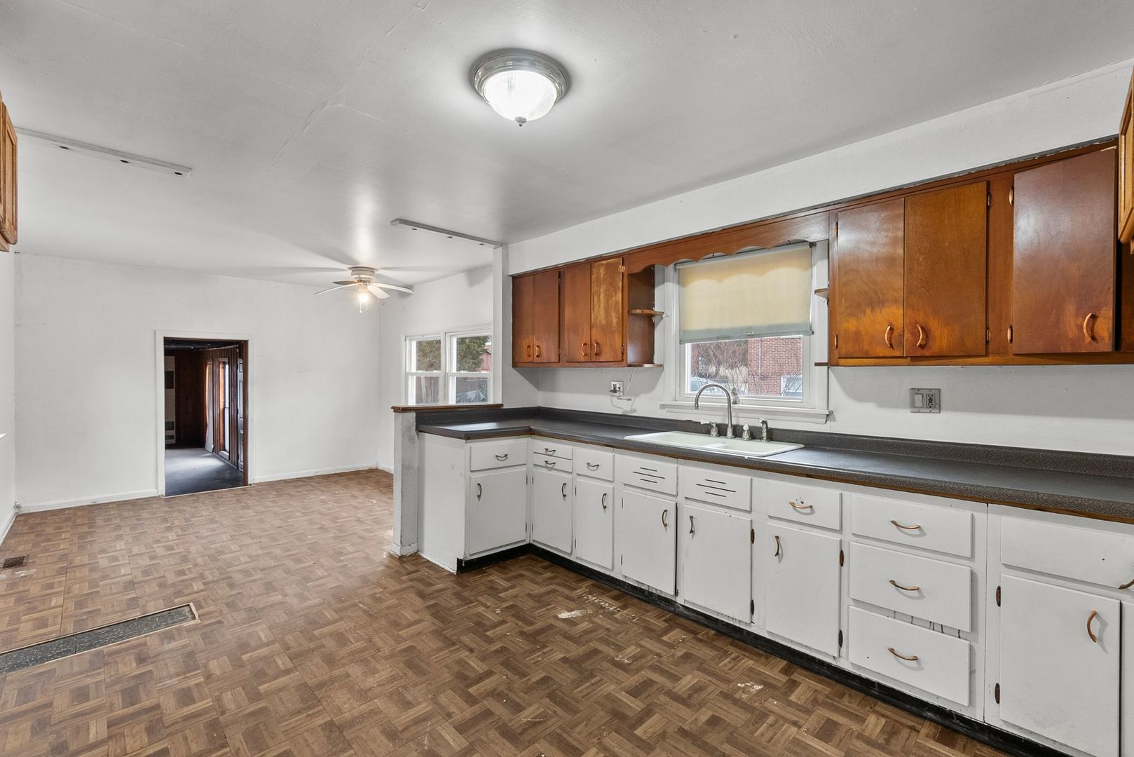 7911 45th Street Lyons, IL 60534 - Photo 6 of 22 a kitchen with sink and cabinets