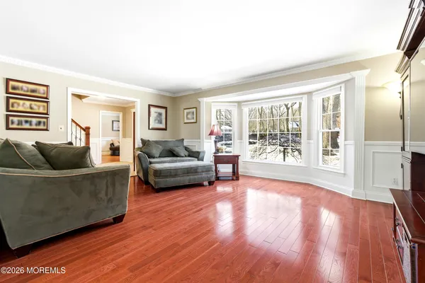 a view of a dining room with furniture and wooden floor