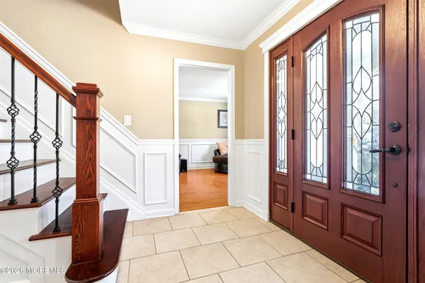 a view of an entryway with wooden floor
