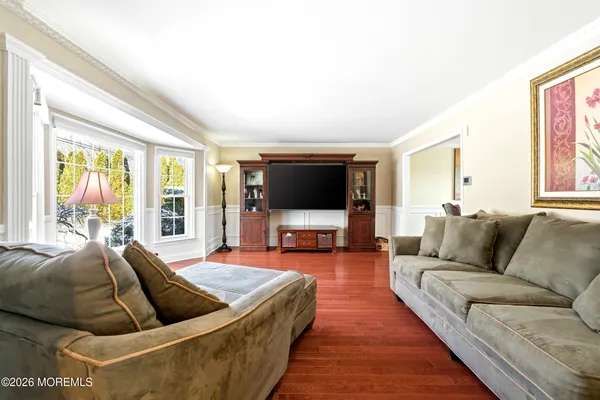 a view of a dining room with furniture and wooden floor