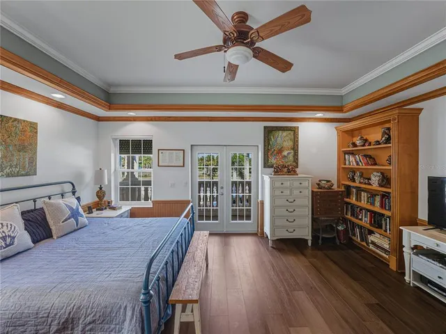 a bedroom with furniture and a book shelf