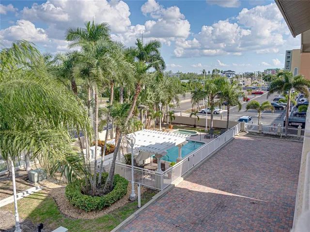 a view of a backyard with sitting area