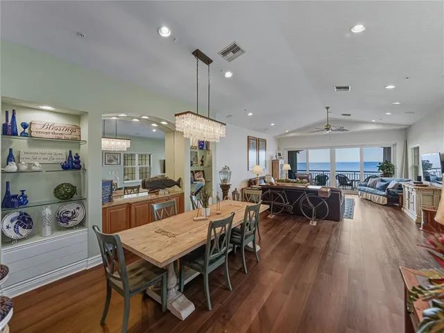 a view of a dining area with furniture and wooden floor
