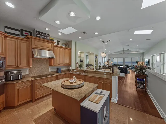 a kitchen with a sink a counter top space and appliances
