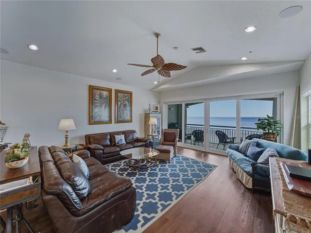a living room with furniture or couch and a wooden floor