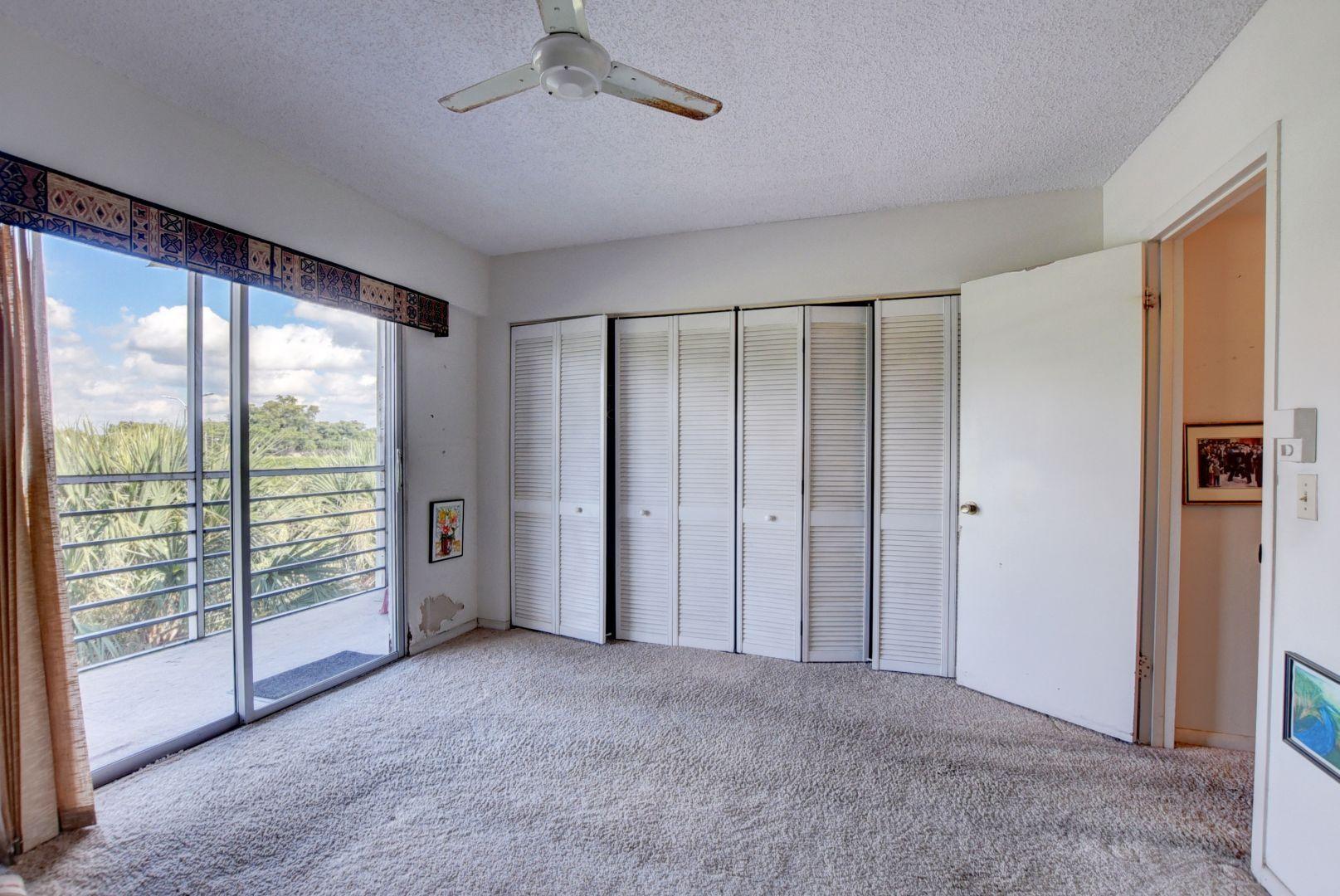 246 Suffolk F Boca Raton, FL 33434 - Photo 11 of 15 a view of an empty room with a window