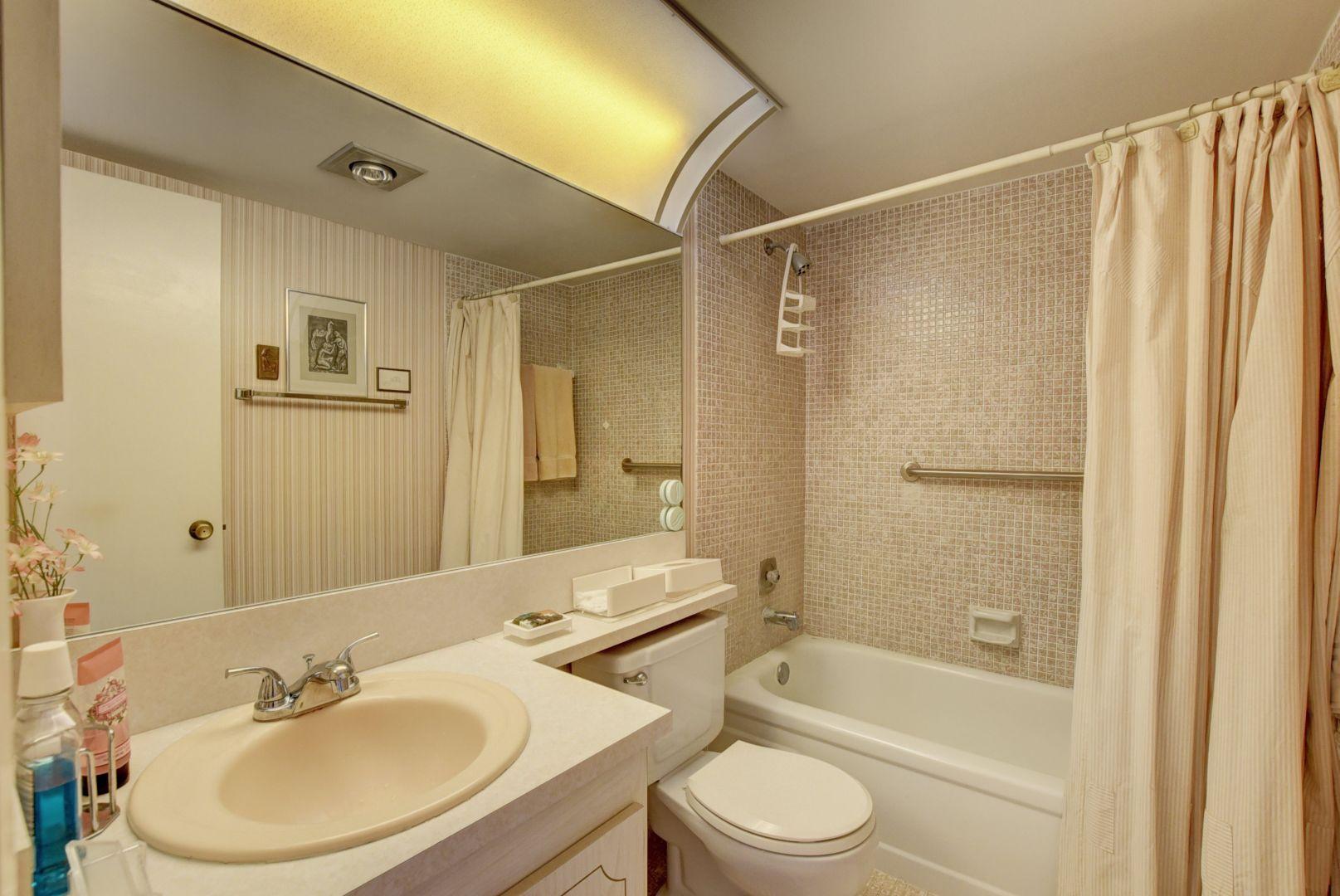 246 Suffolk F Boca Raton, FL 33434 - Photo 13 of 15 a bathroom with a sink toilet and shower