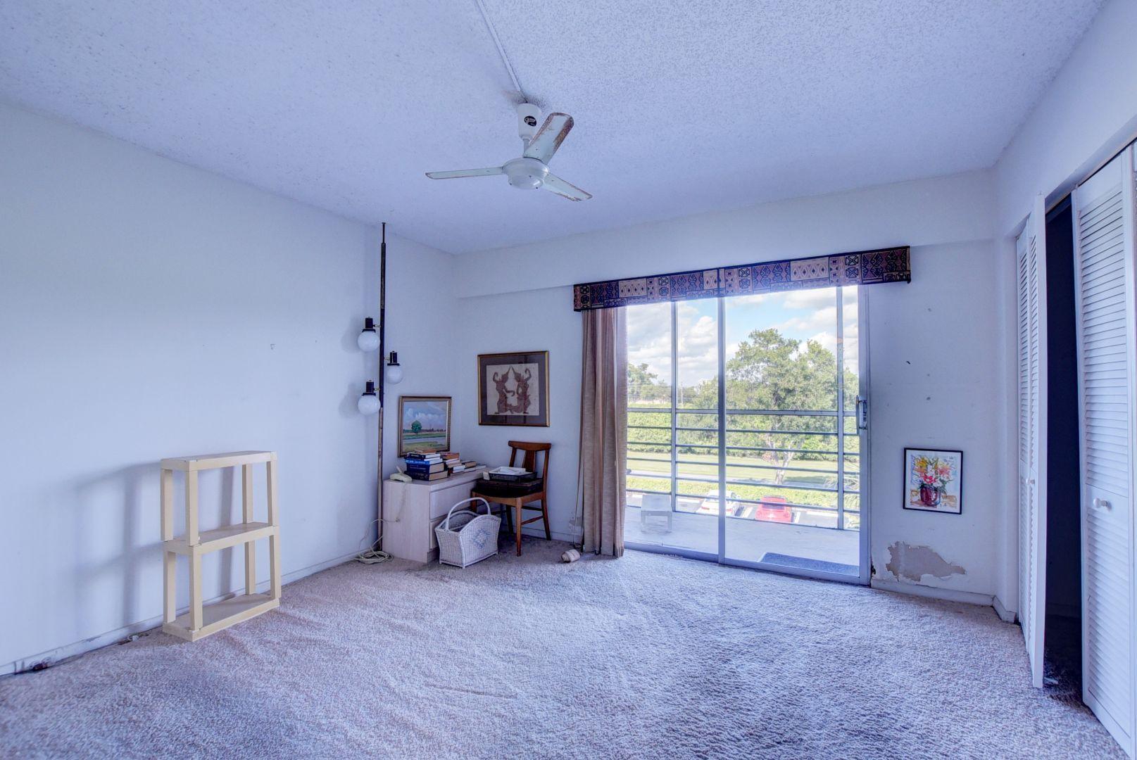 246 Suffolk F Boca Raton, FL 33434 - Photo 10 of 15 a view of a livingroom with a large window