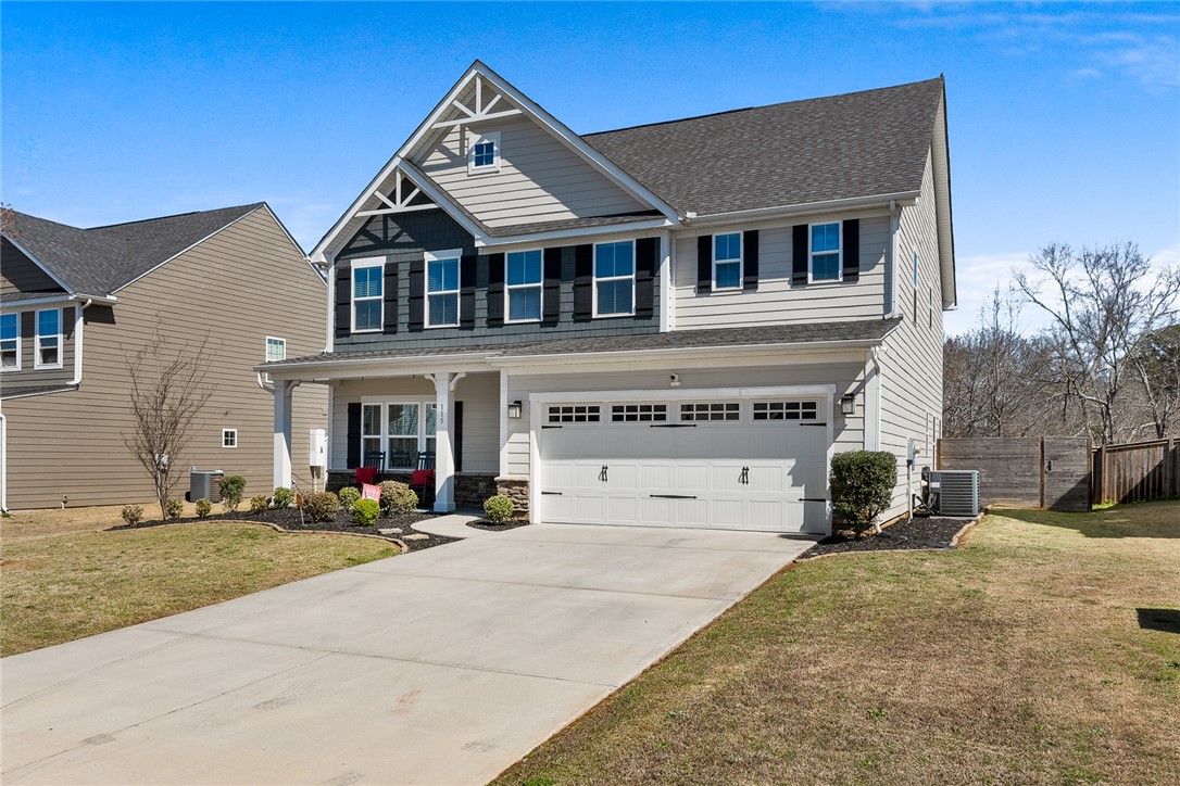 115 Bronson Ridge Anderson, SC 29621 - Photo 2 of 40 Gable roof accents and a wide concrete driveway frame this two-story traditional residence.