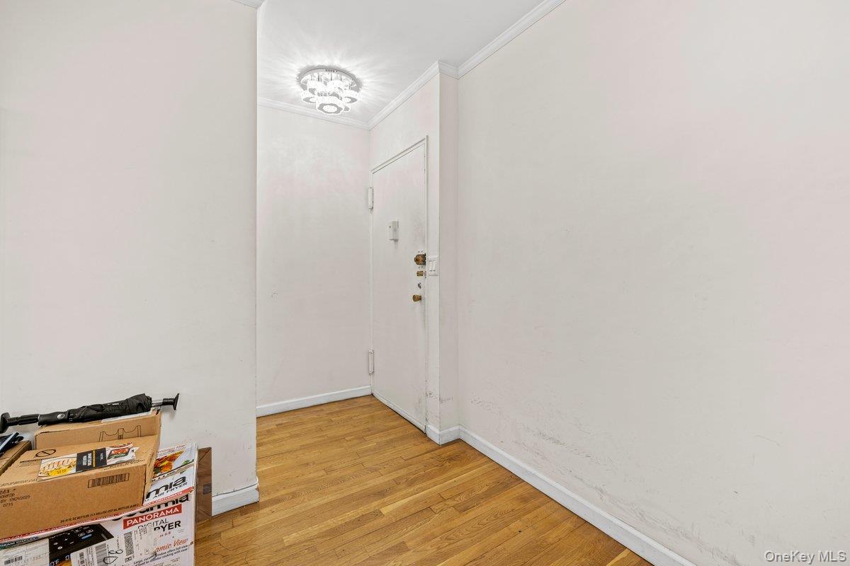 6135 98th Street, Unit 8D Queens, NY 11374 - Photo 11 of 17 a view of room with wooden floor