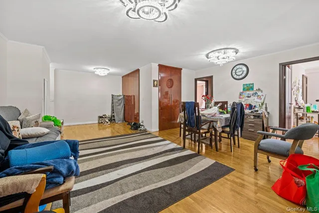 a spacious bedroom with a bed and a table in it