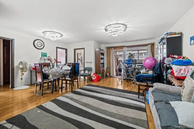 a living room with furniture a rug and a flat screen tv