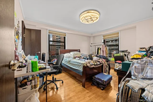 a bedroom with furniture and a window