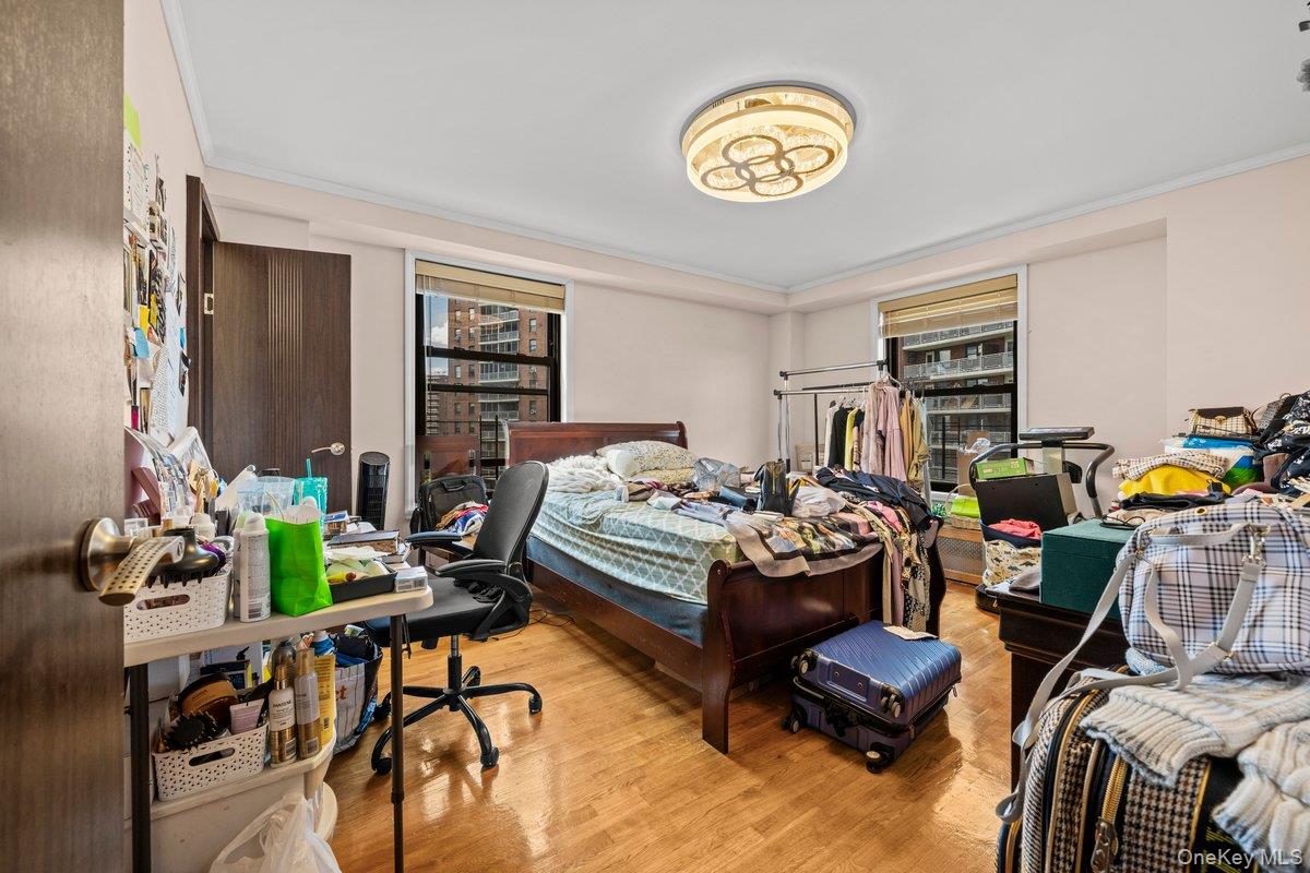 6135 98th Street, Unit 8D Queens, NY 11374 - Photo 3 of 17 a bedroom with furniture and a window