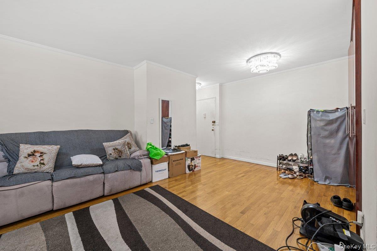 6135 98th Street, Unit 8D Queens, NY 11374 - Photo 10 of 17 a bedroom with furniture and a couch