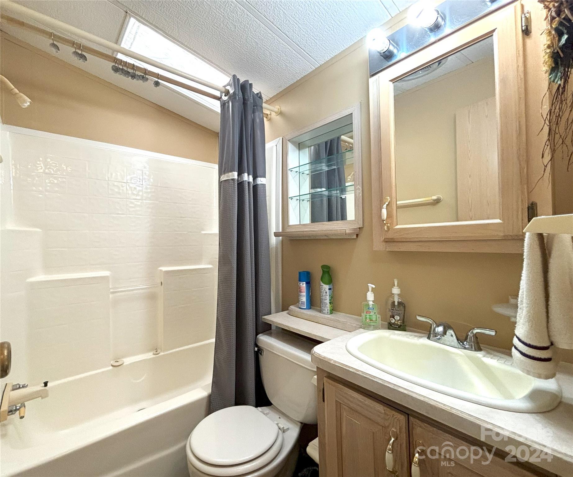 306 Mallard Loop Waynesville, NC 28785 - Photo 18 of 34 a bathroom with a sink toilet and shower