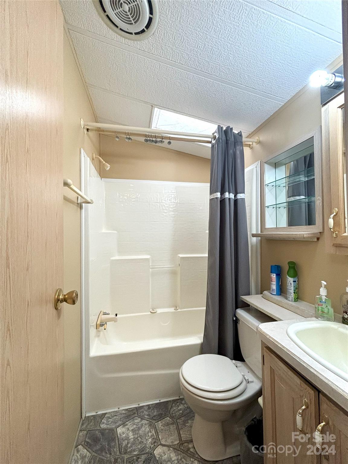 306 Mallard Loop Waynesville, NC 28785 - Photo 19 of 34 a bathroom with a sink toilet and shower
