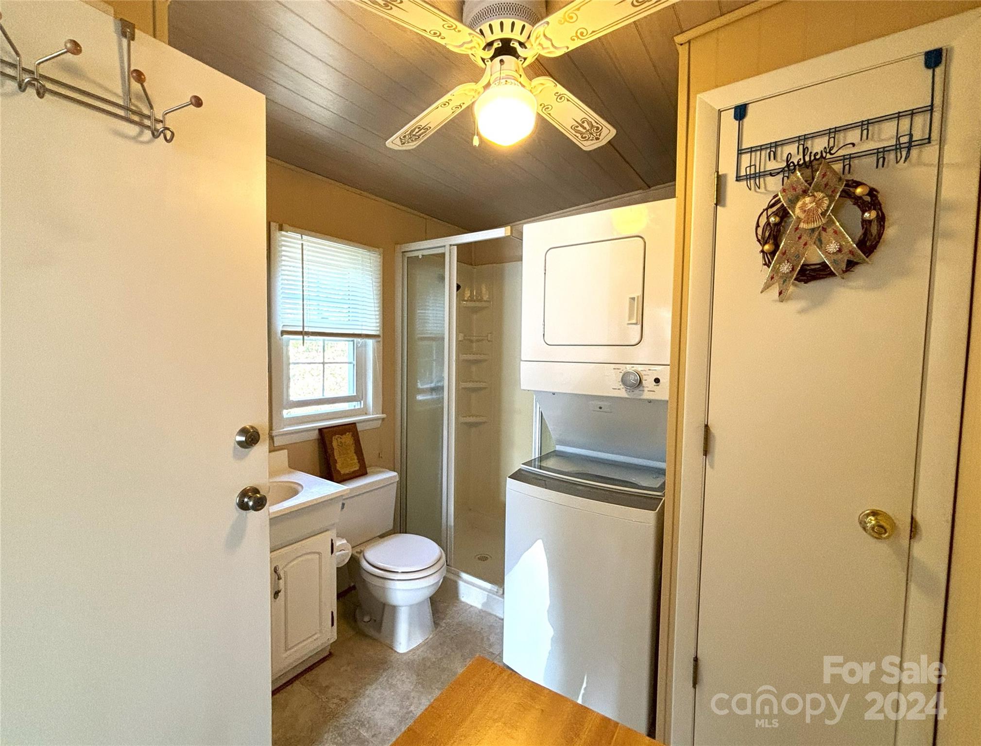 306 Mallard Loop Waynesville, NC 28785 - Photo 21 of 34 a bathroom with a toilet sink and shower