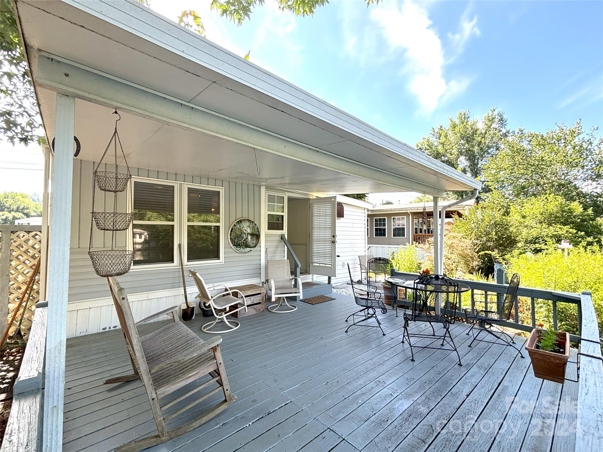 306 Mallard Loop Waynesville, NC 28785 - Photo 25 of 34 a sitting area with couch and wooden floor