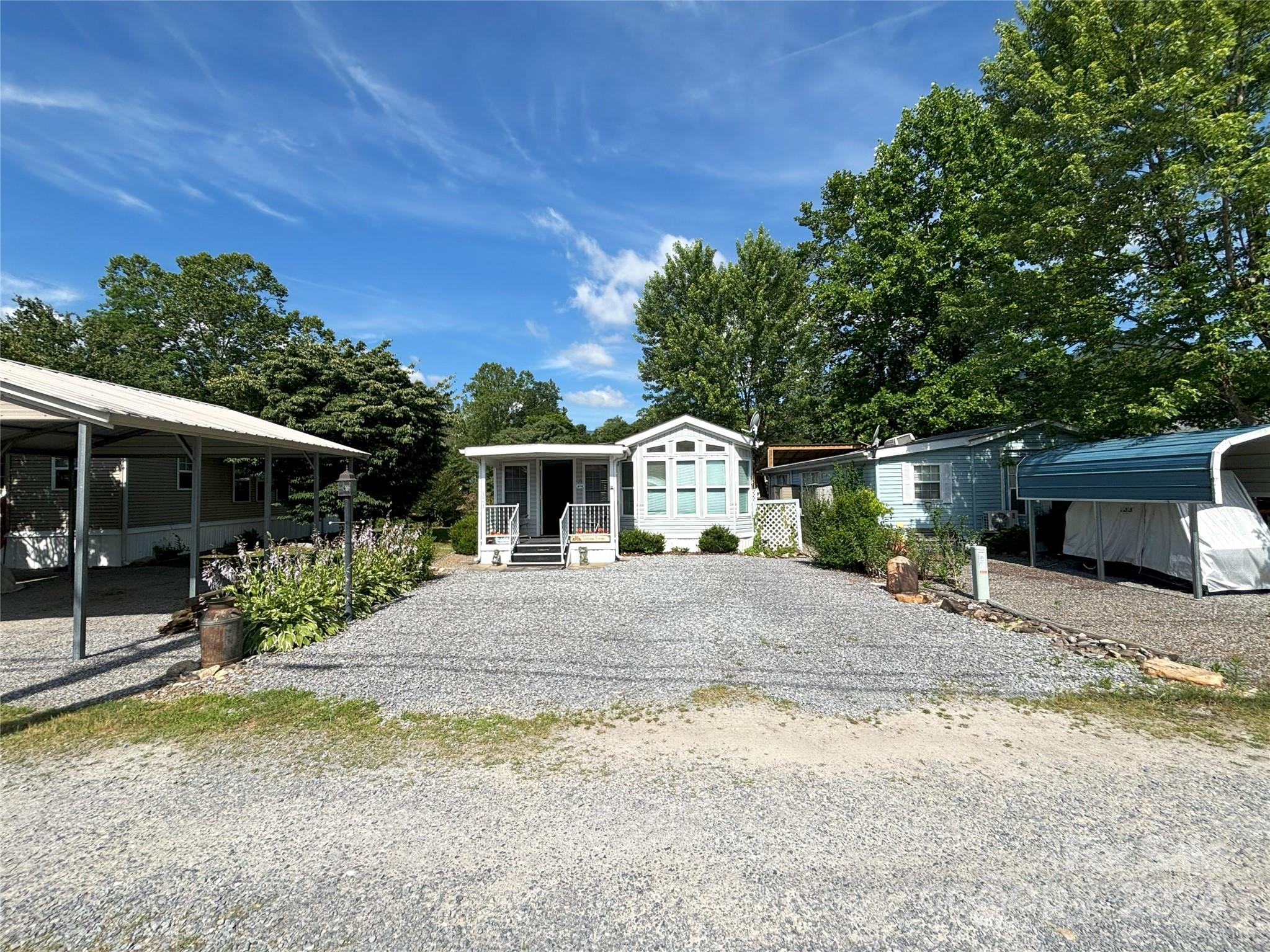 306 Mallard Loop Waynesville, NC 28785 - Photo 32 of 34 a front view of a house with a yard and trees