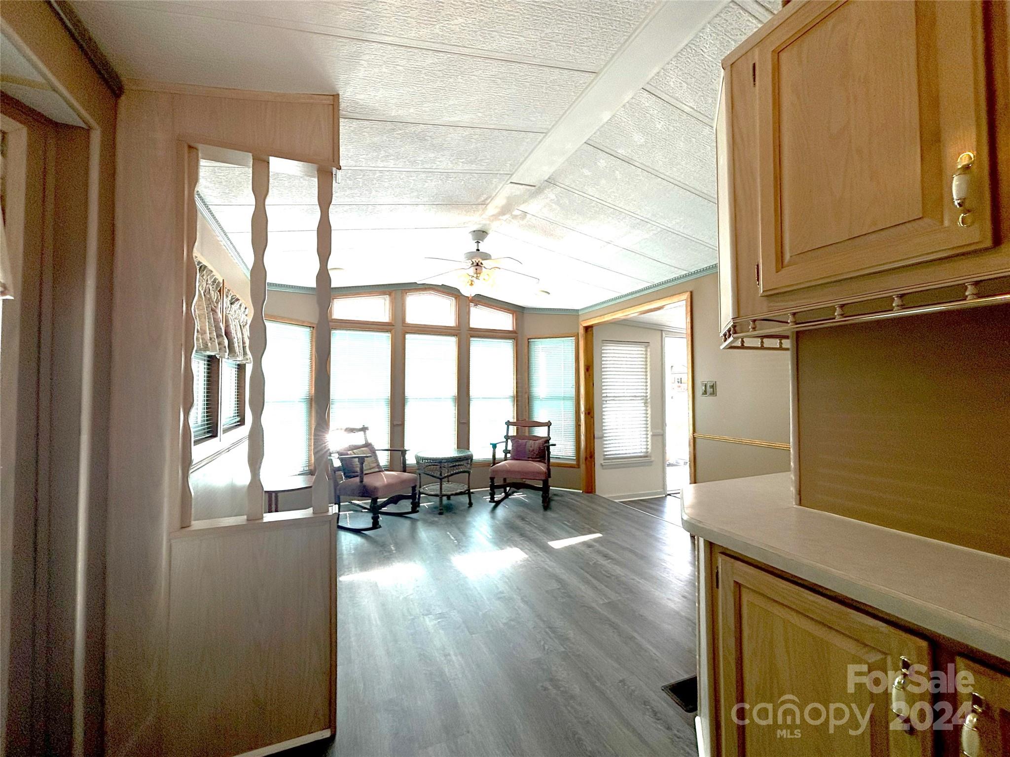 306 Mallard Loop Waynesville, NC 28785 - Photo 5 of 34 a living room with furniture and floor to ceiling windows