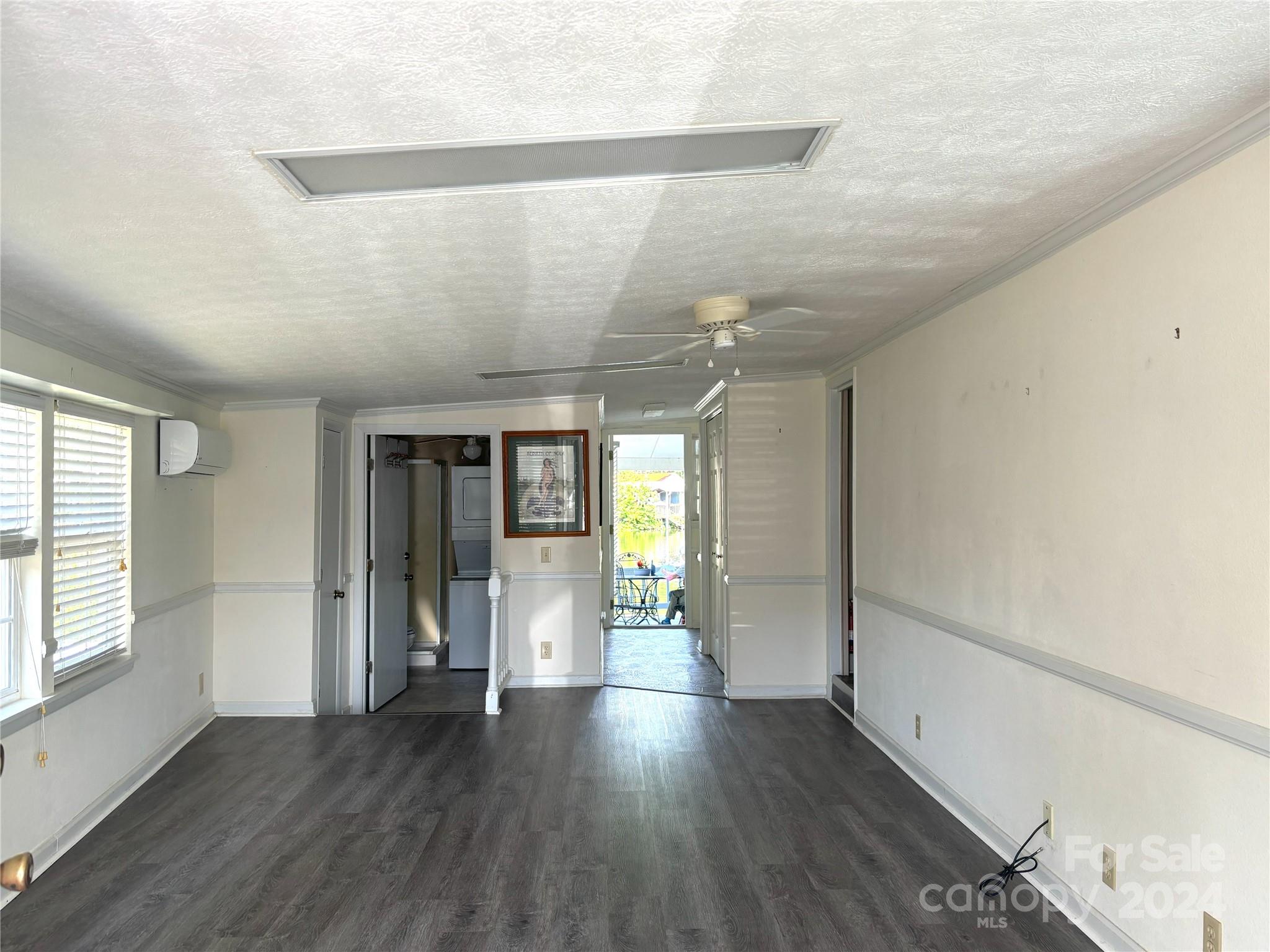 306 Mallard Loop Waynesville, NC 28785 - Photo 6 of 34 a view of an empty room with wooden floor and a window