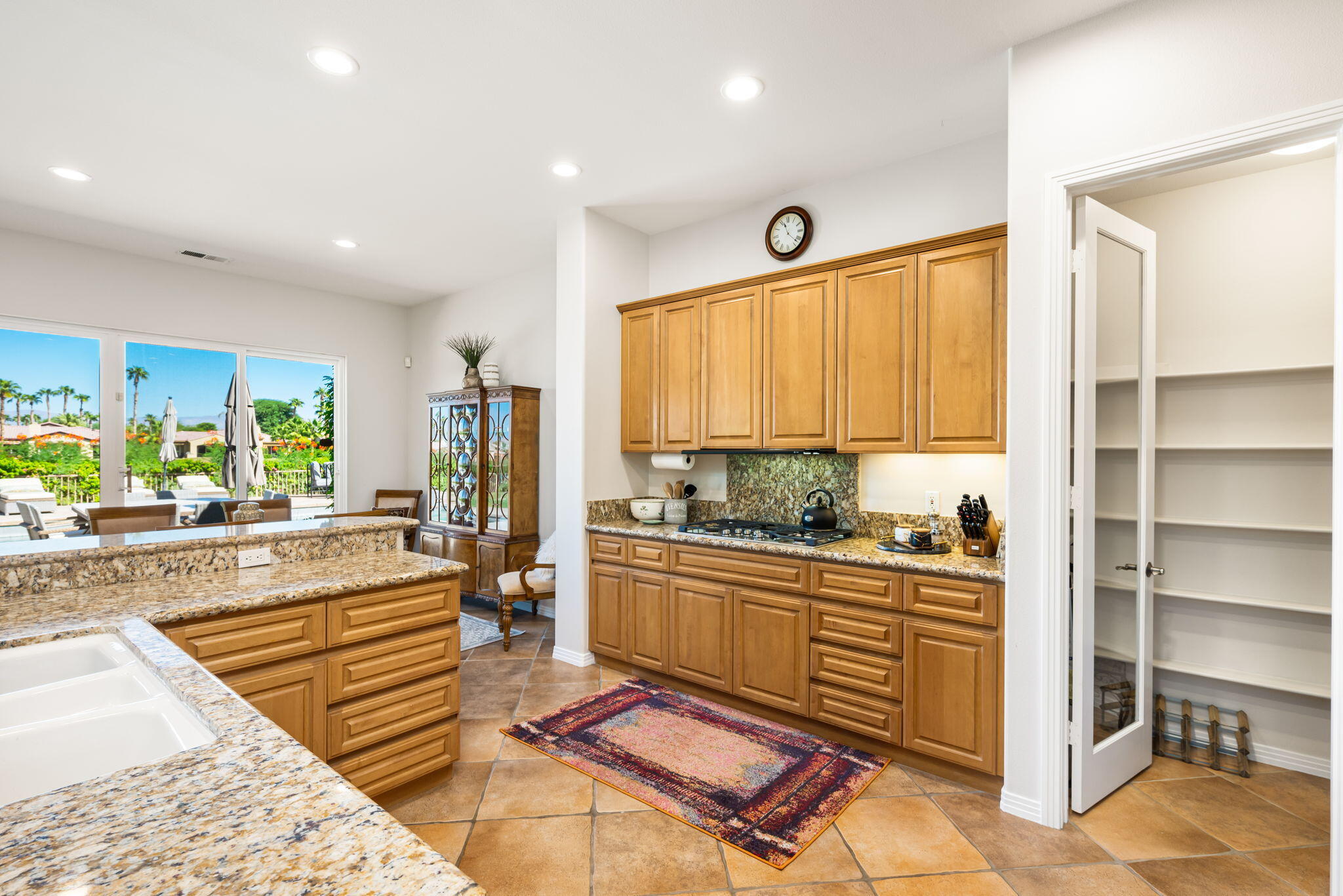 81260 Golf View Drive La Quinta, CA 92253 - Photo 19 of 58 a living room with stainless steel appliances furniture stove and a kitchen view