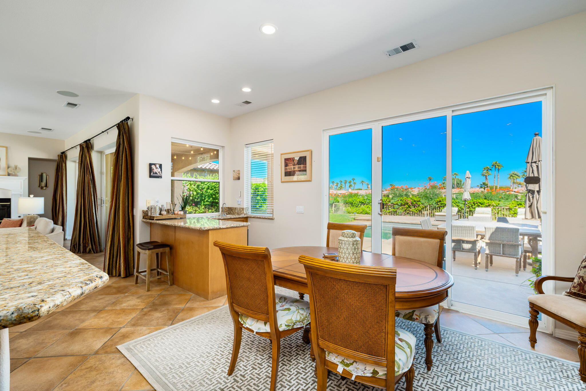 81260 Golf View Drive La Quinta, CA 92253 - Photo 22 of 58 a view of a dining room with furniture window and outside view