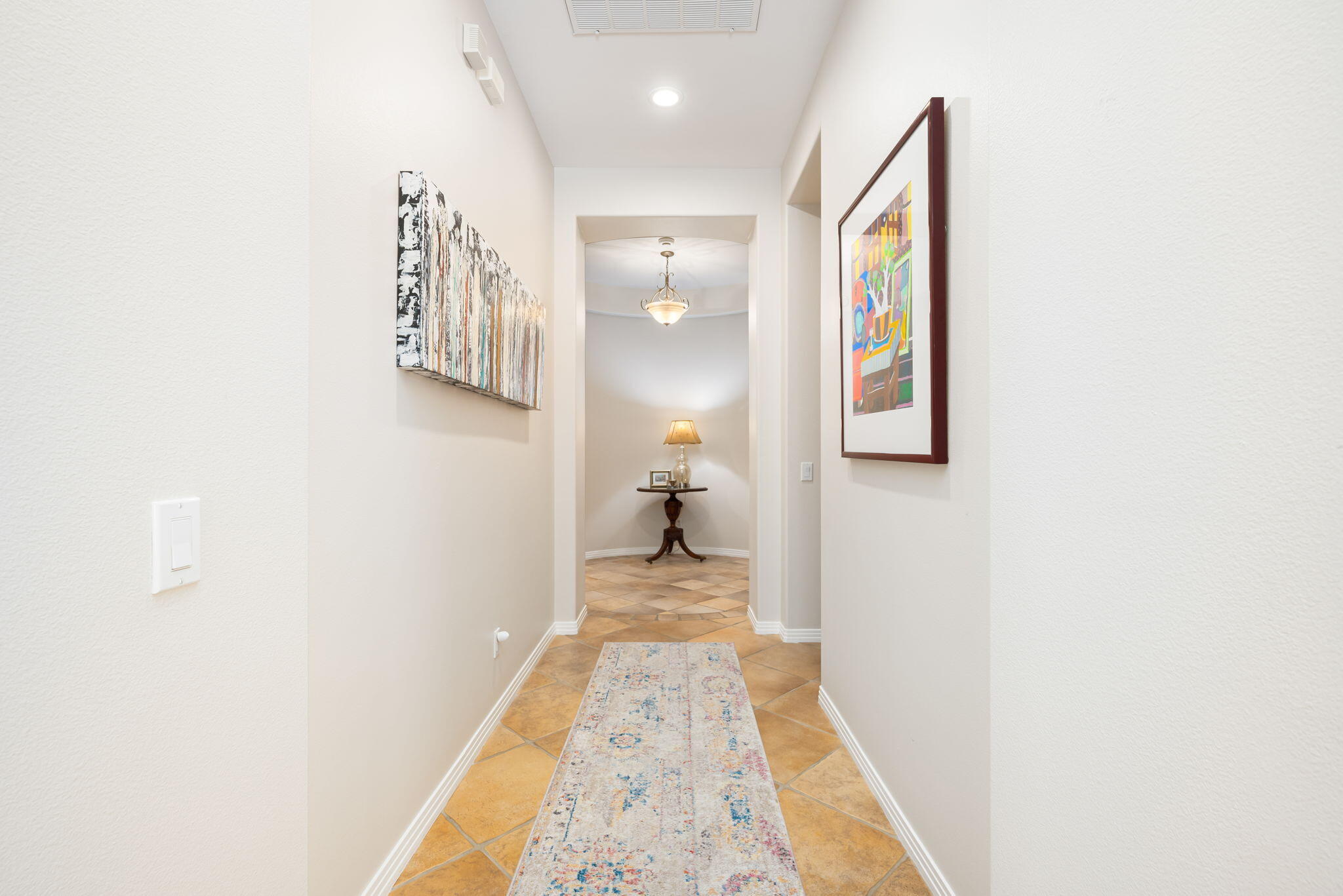 81260 Golf View Drive La Quinta, CA 92253 - Photo 23 of 58 a view of a hallway with wooden floor and a bathroom