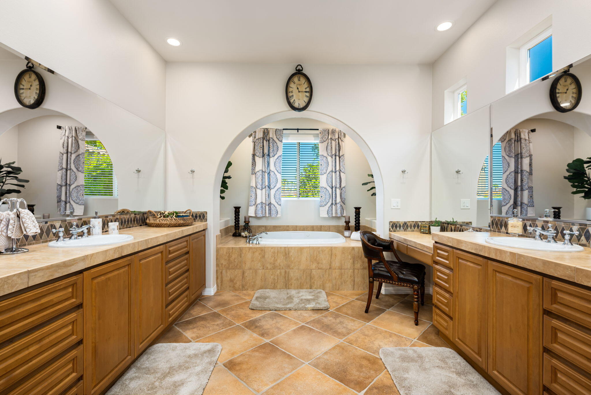 81260 Golf View Drive La Quinta, CA 92253 - Photo 27 of 58 a large bathroom with a double vanity sink a mirror and a bathtub