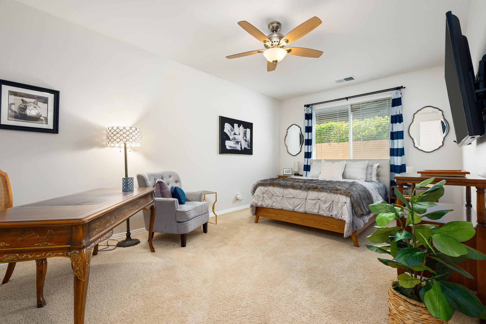 81260 Golf View Drive La Quinta, CA 92253 - Photo 30 of 58 a bedroom with a bed table and a chair