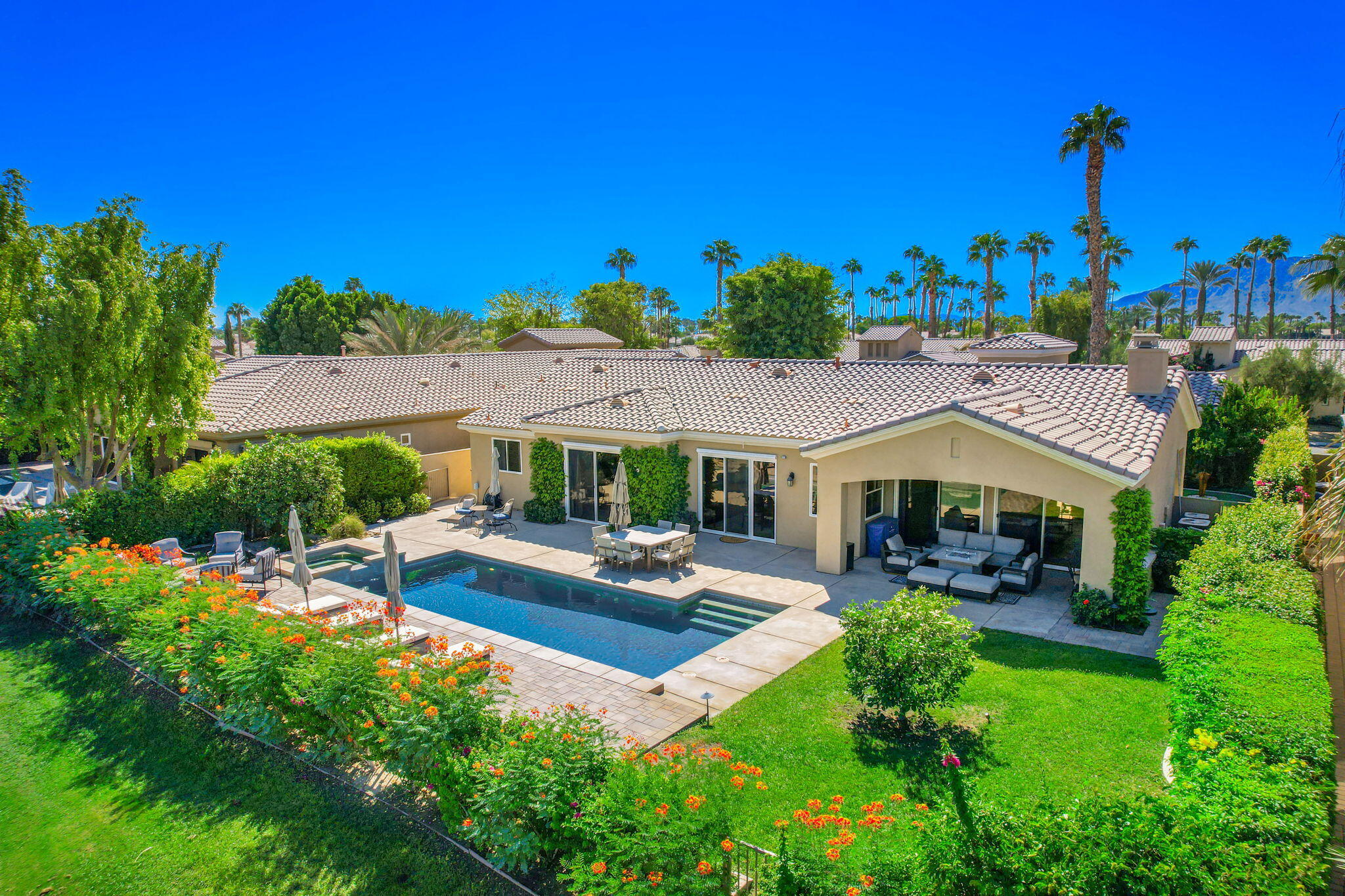 81260 Golf View Drive La Quinta, CA 92253 - Photo 3 of 58 a front view of a house with garden