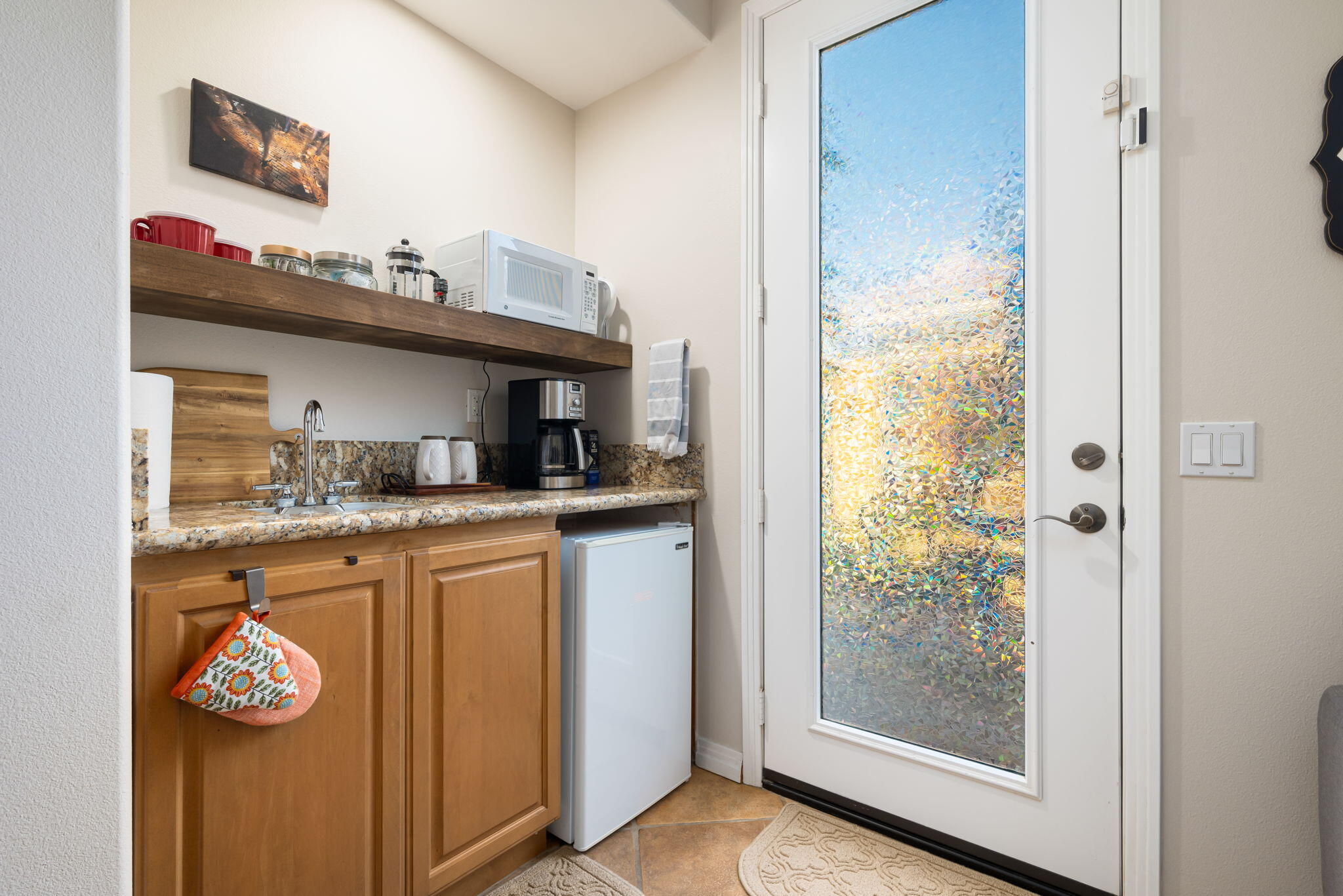 81260 Golf View Drive La Quinta, CA 92253 - Photo 37 of 58 a kitchen with a sink and a refrigerator
