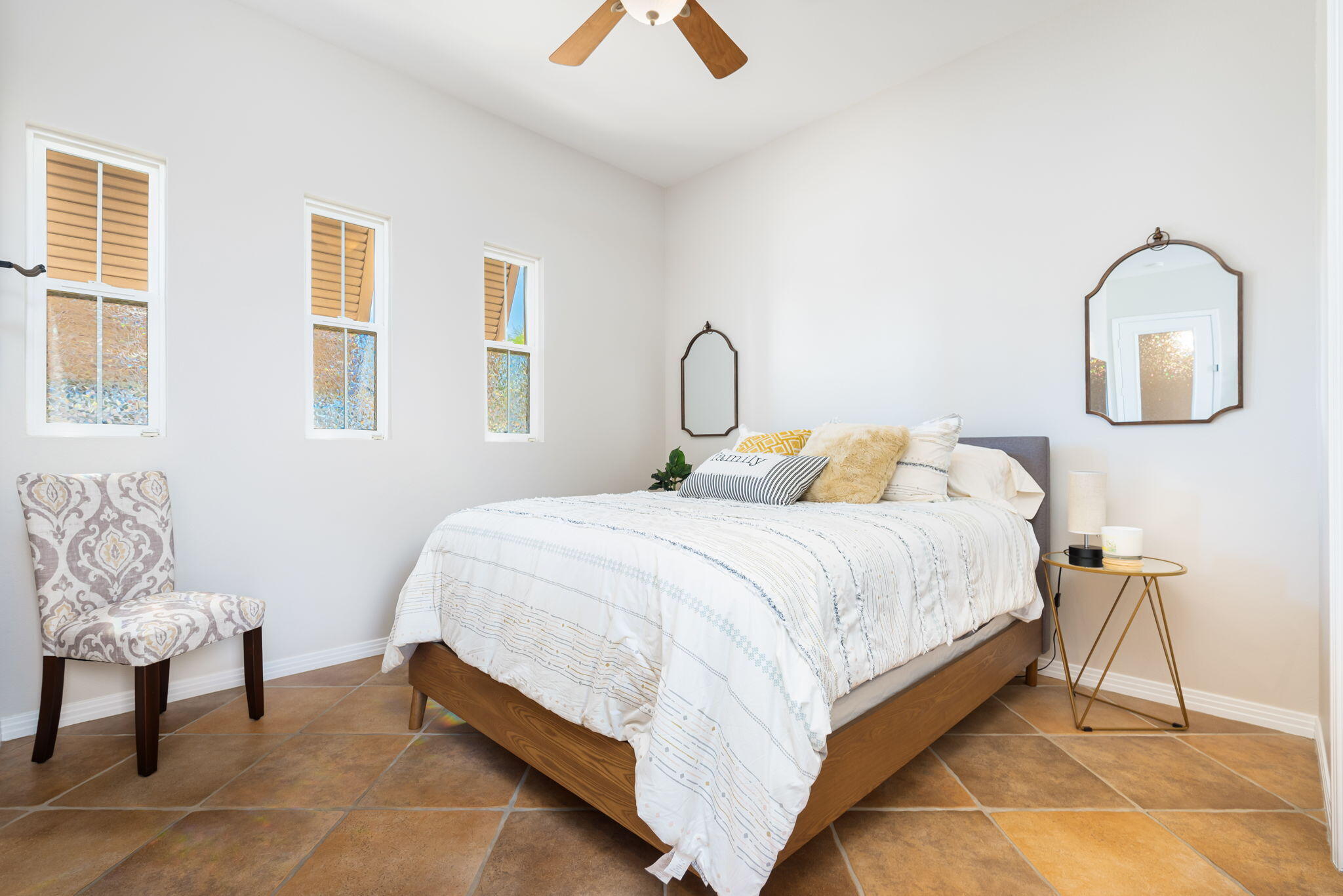 81260 Golf View Drive La Quinta, CA 92253 - Photo 38 of 58 a bedroom with a bed and a chair